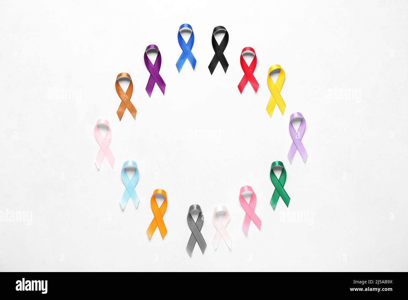 Frame made of awareness ribbons on light background. World Cancer Day ...