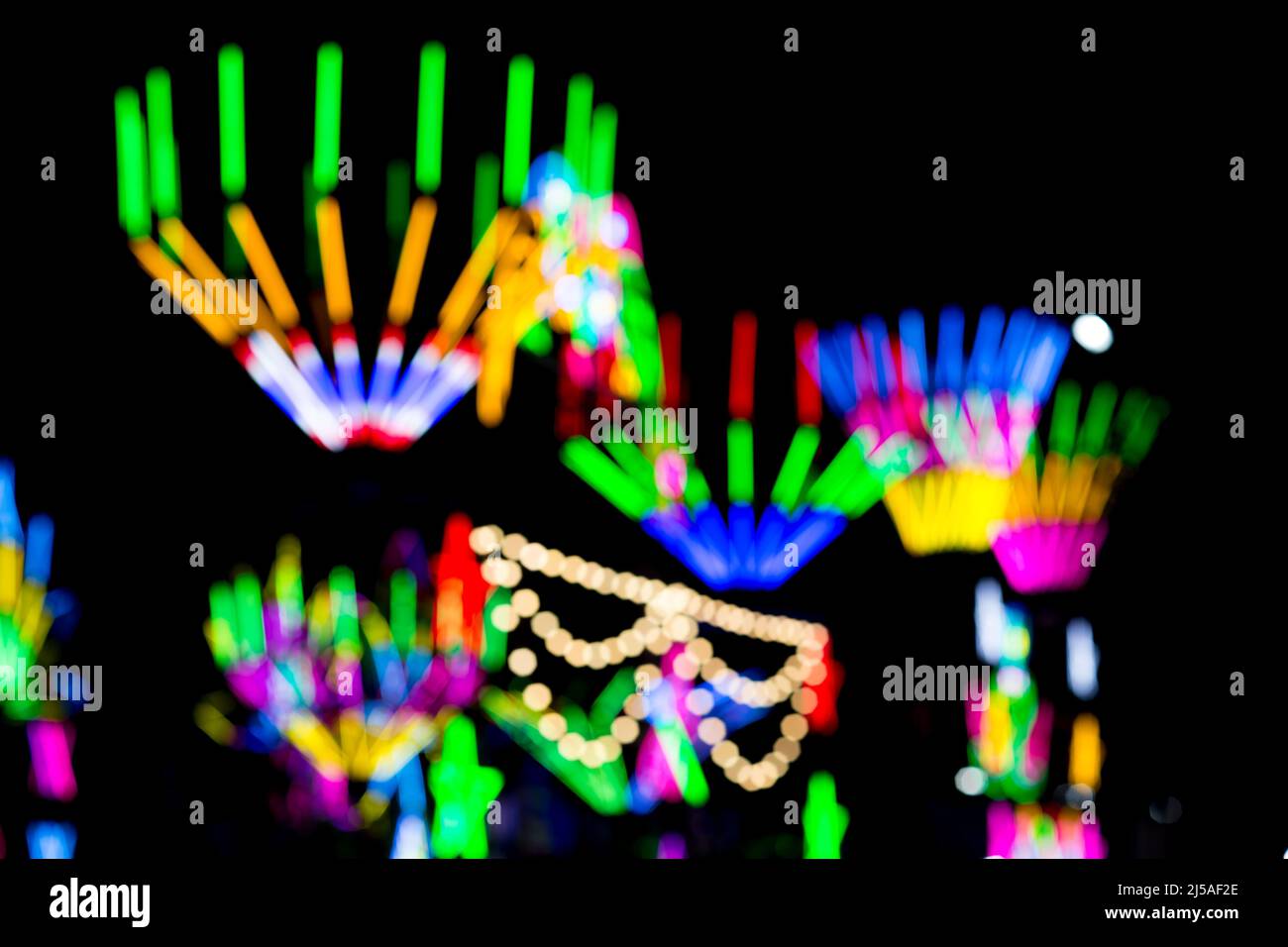 Blured Multi-colored neon lights at night. Stock Photo
