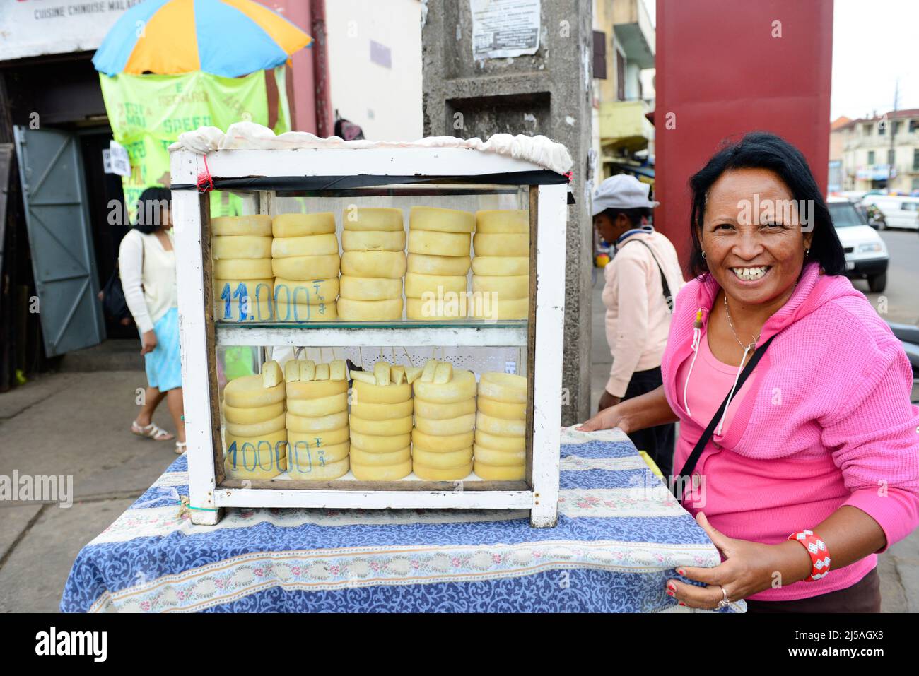 A smiling Malagasy cheese vendor in Antananarivo, Madagascar. Stock Photo