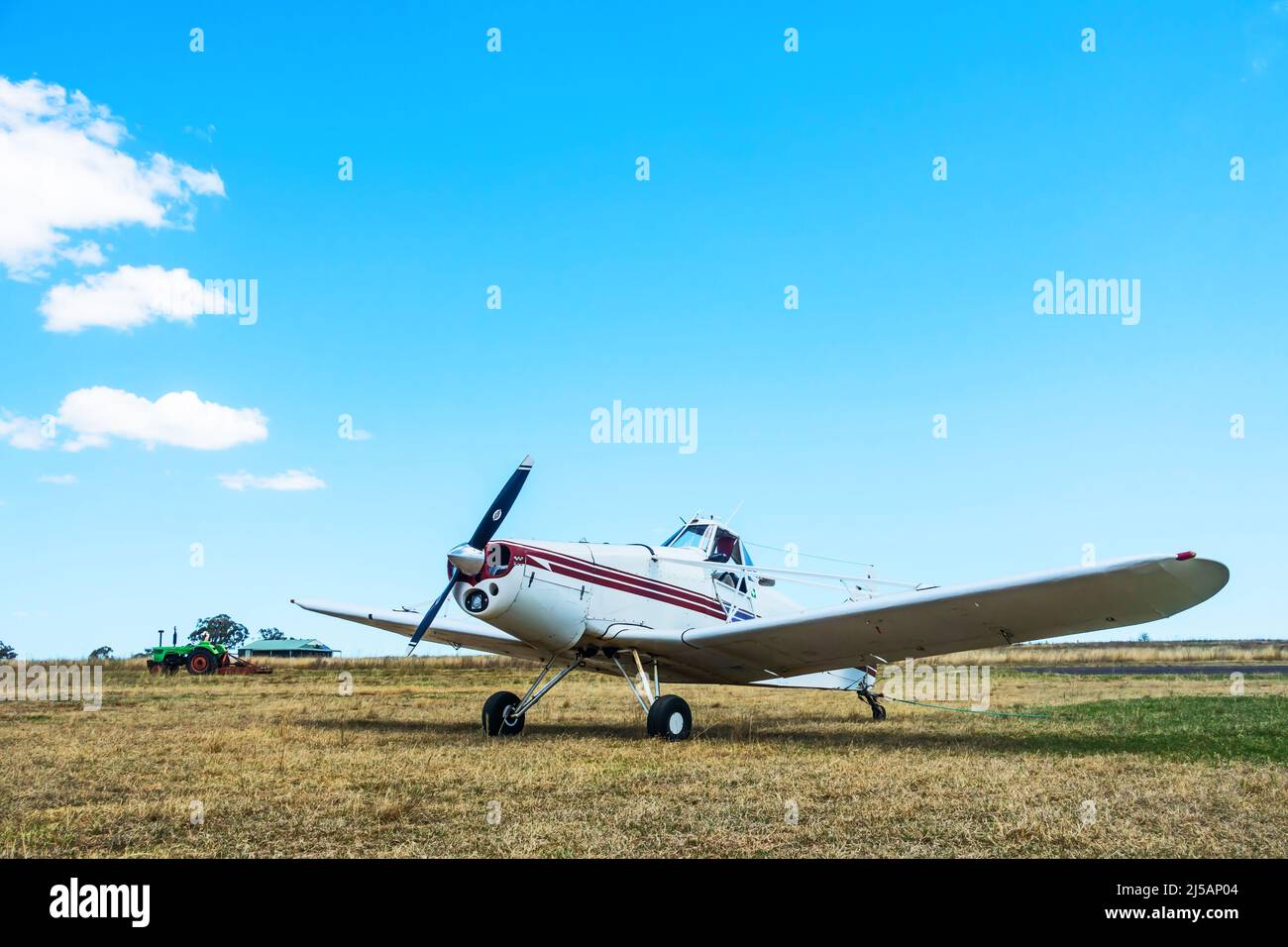 Low angle view of a 1965 Piper Pawnee PA-25-235 airplane on a grass airfield. Stock Photo