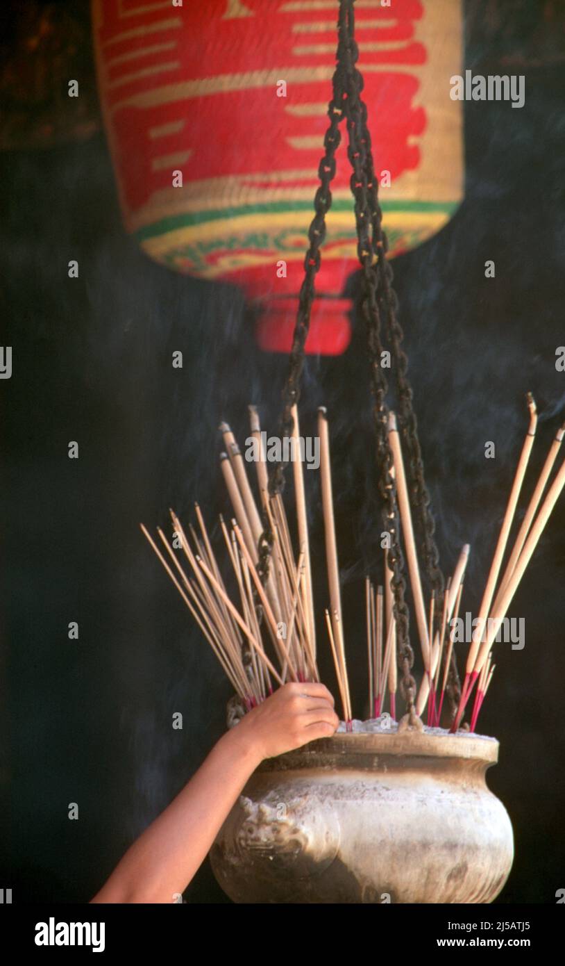 Singapore: Incense sticks are placed in an urn at Thian Hock Keng Temple, Telok Ayer Street in Singapore's Chinatown area. The temple, also known as the Tianfu Temple, was established in 1839 and was built for the worship of the Chinese sea goddess, Mazu. It is the oldest Hokkien temple in the country. Stock Photo