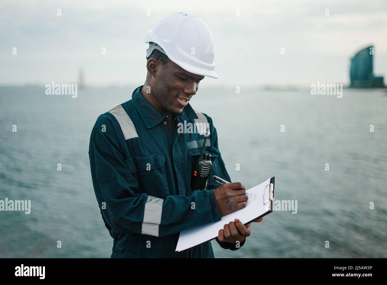 Marine navigational officer or chief mate on navigation watch on ship or vessel Stock Photo