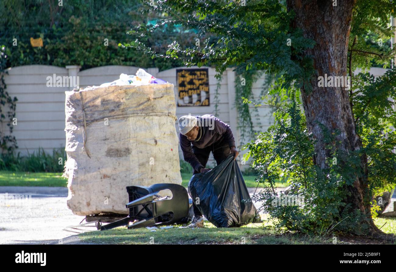 Johannesburg, South Africa an unemployed man collects recyclable