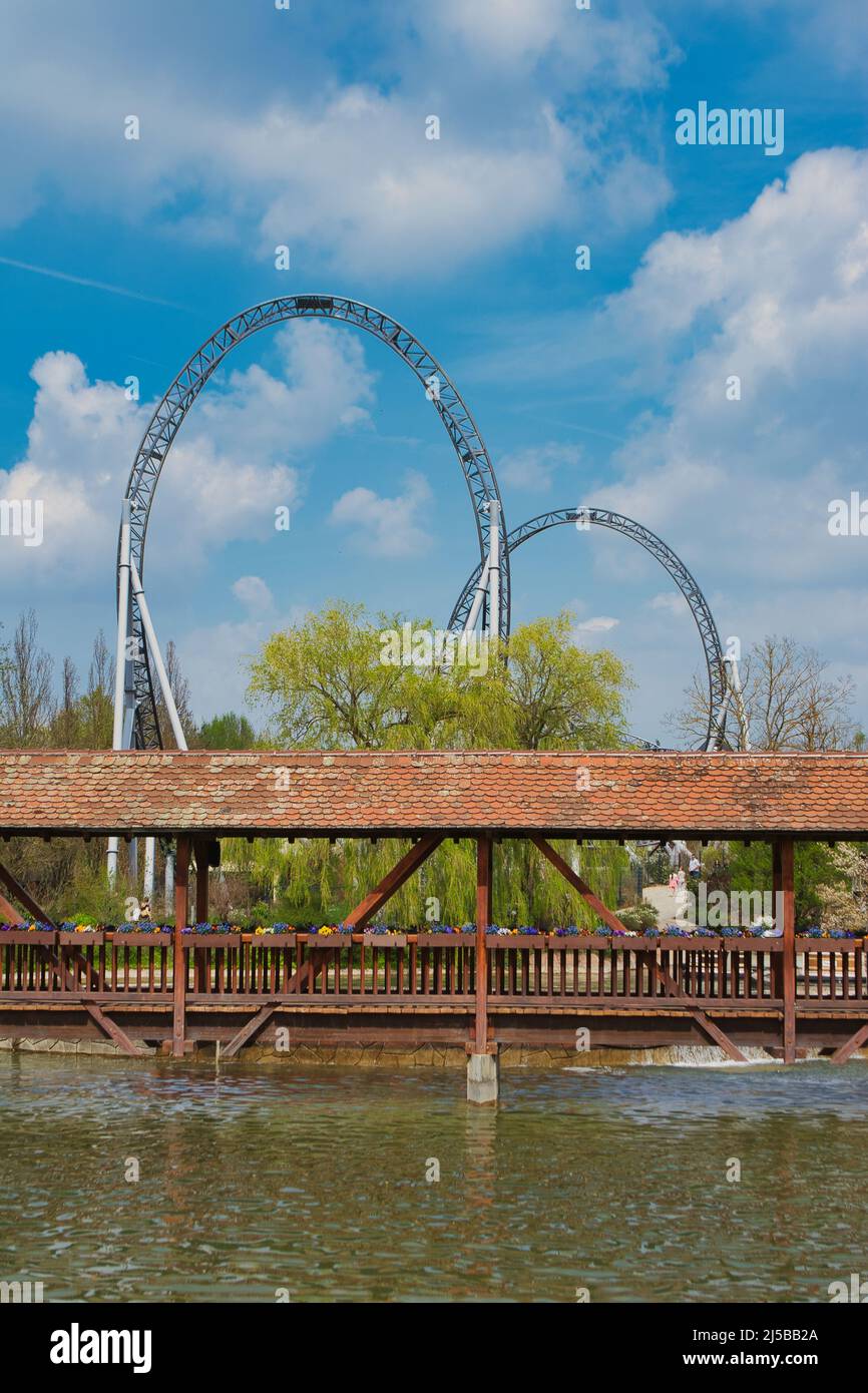 Life is a roller coaster, roller coaster behind bridge in Tripsdrill, southern Germany Stock Photo