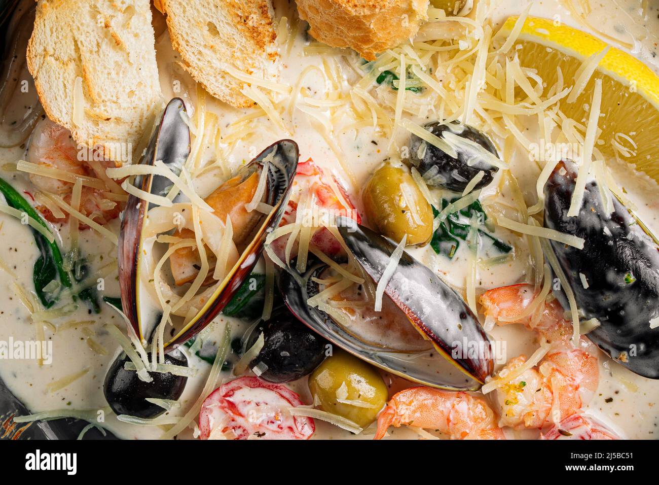 Closeup on seafood saute with wheat bread Stock Photo