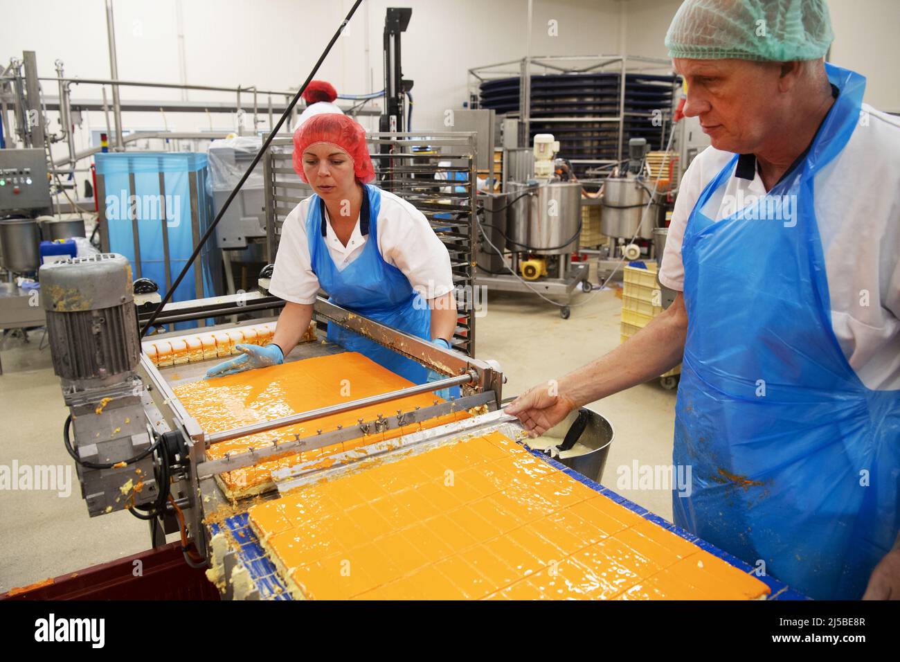 Almere, Netherlands. 22nd Apr, 2022. 2022-04-22 07:23:05 ALMERE - The HEMA bakery makes the very first orange tompouces for King's Day. ANP OLAF KRAAK netherlands out - belgium out Credit: ANP/Alamy Live News Stock Photo
