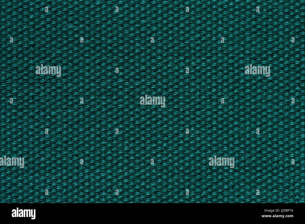 Stylish material texture in admirable dark green colour. Stock Photo