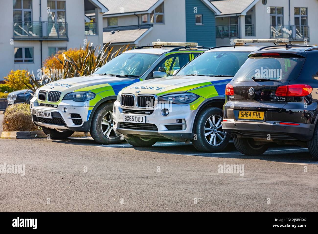 Two BMW police cars parked in a car park Stock Photo