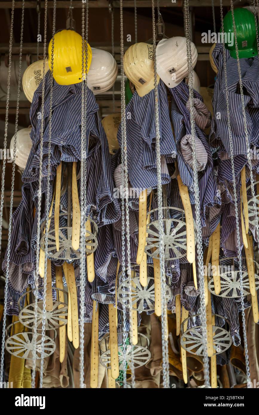 Dortmund, North Rhine-Westphalia, Germany - LWL Industrial Museum Zollern Colliery. In the former washhouse, miners' clothing hangs in coffers under t Stock Photo