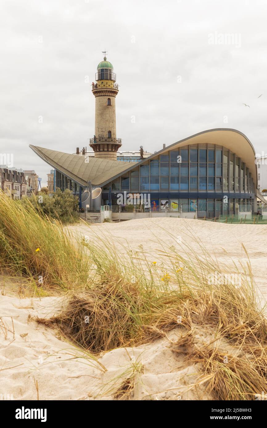 Rostock, July 20, 2021: Teepott building and lighthouse at teh beach of Warnemünde. Stock Photo