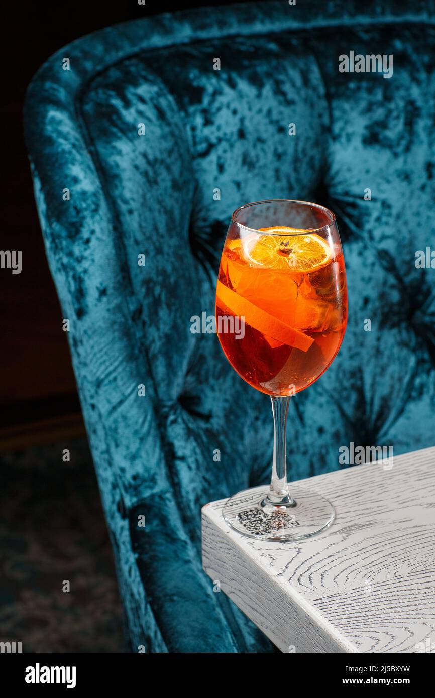 Glass of ice cold Aperol spritz cocktail served in a wine glass ...