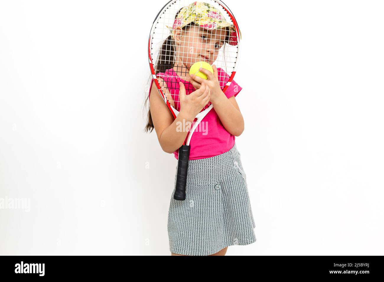 Baby With Racket Cute little girl with tennis racket in her hands on white background ...