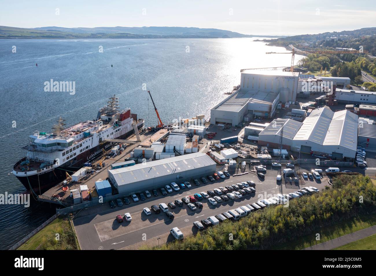 Greenock, Scotland, UK. 22nd Apr, 2022. PICTURED: Glen Sannox ferry which lies in the still under fabrication, late and over budget amid new controversy over payments and procurement processes. Aerial drone views of the Ferguson Marine Ship Yard in Greenock showing the Glen Sannox ferry. Credit: Colin Fisher/Alamy Live News Stock Photo