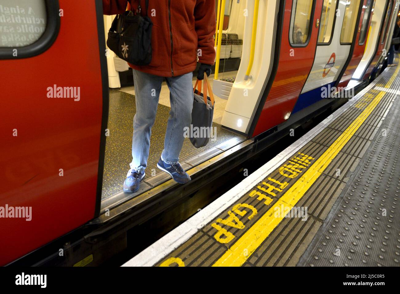 London, England, UK. London underground station platform - Mind The Gap warning Stock Photo