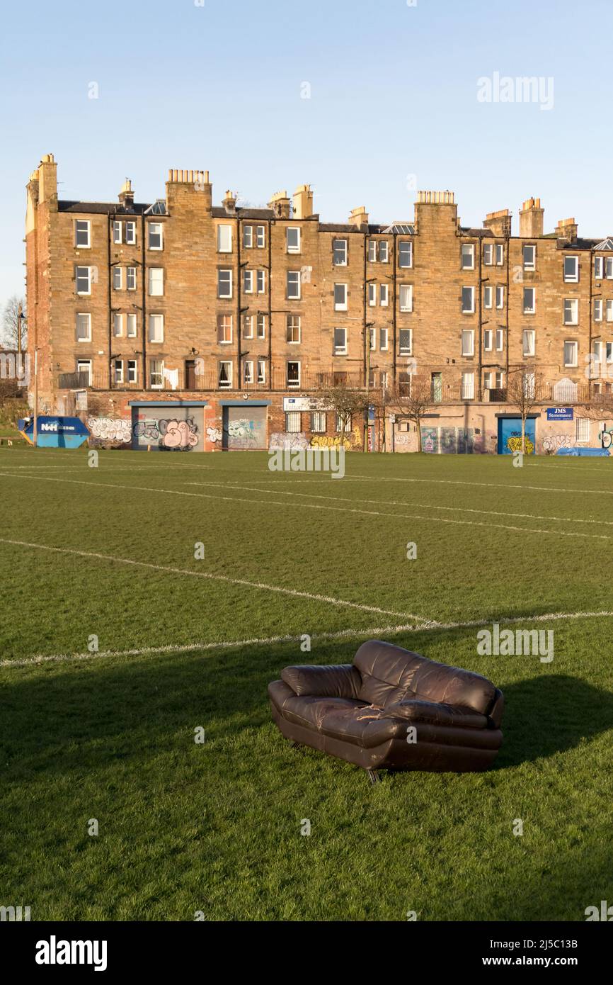A sofa illegally dumped in a park in Edinburgh city centre Stock Photo