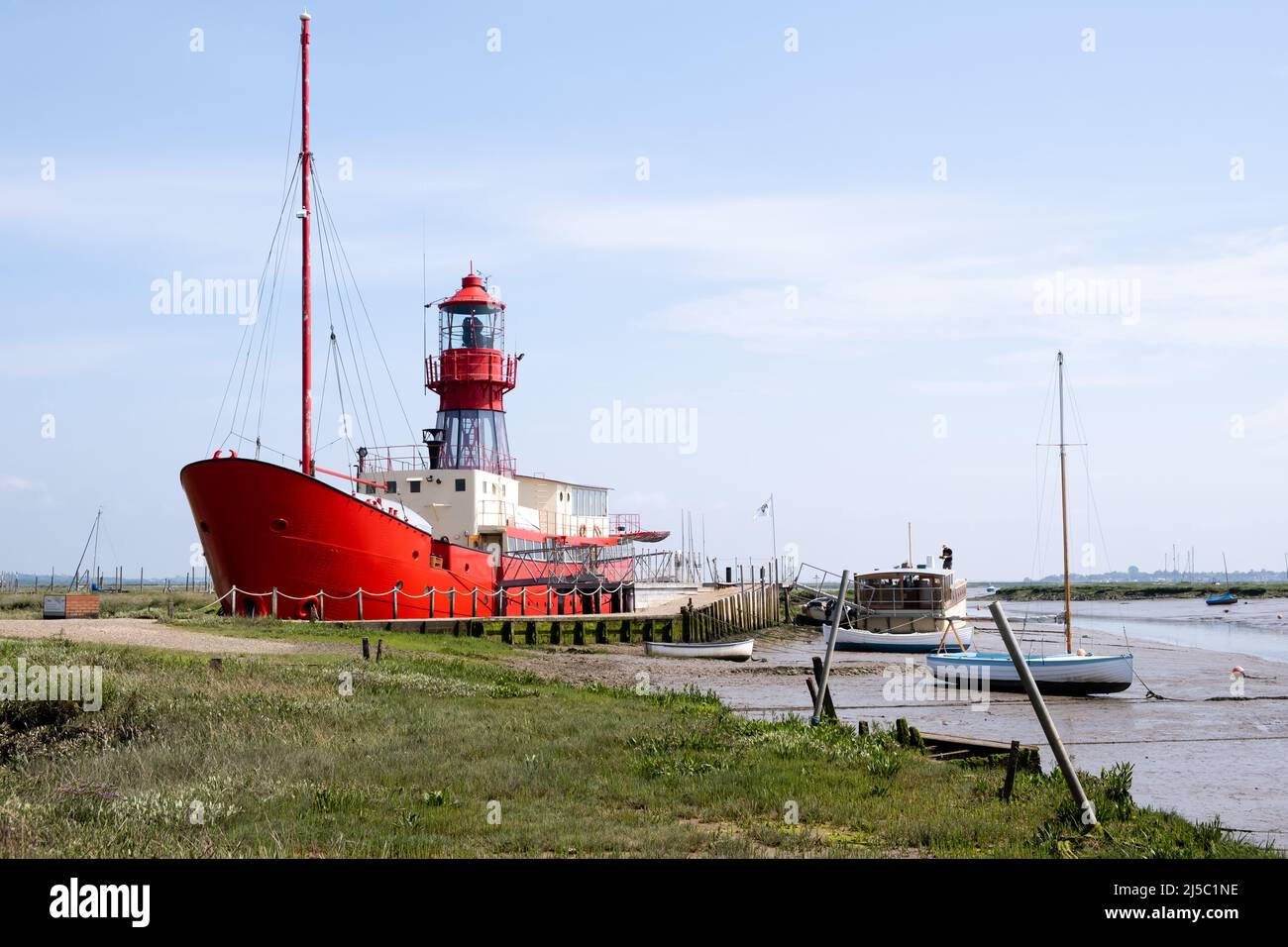 Trinity Light Ship moored at Tollesbury Marina alongside the River Blackwater and the Tollesbury Salt Marshes just outside the picturesque Essex villa Stock Photo