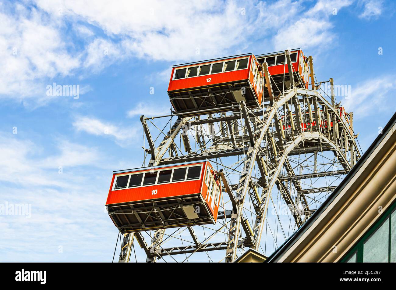 Ferris wheel with red cabins of the Prater amusement park in Vienna, Austria. Stock Photo