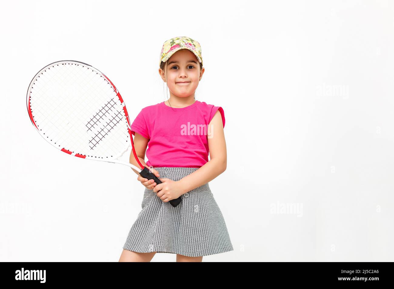 Little Tennis Rackets little girl with a tennis racket isolated on a over white Stock Photo ...