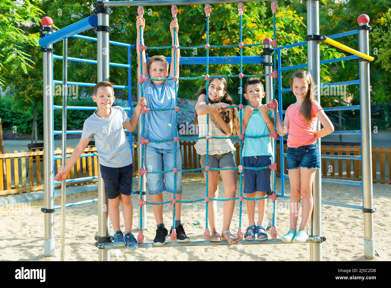Happy children playing at playground Stock Photo - Alamy
