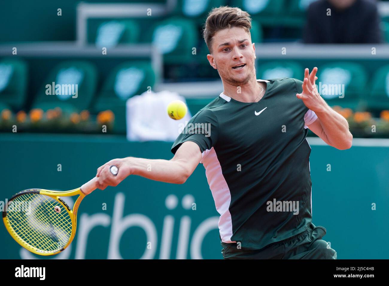 Belgrade, Serbia, 20th April 2022. Miomir Kecmanovic of Serbia plays  forehand against John Millman of Australia during the day three of Serbia  Open ATP 250 Tournament at Novak Tennis Centre in Belgrade,
