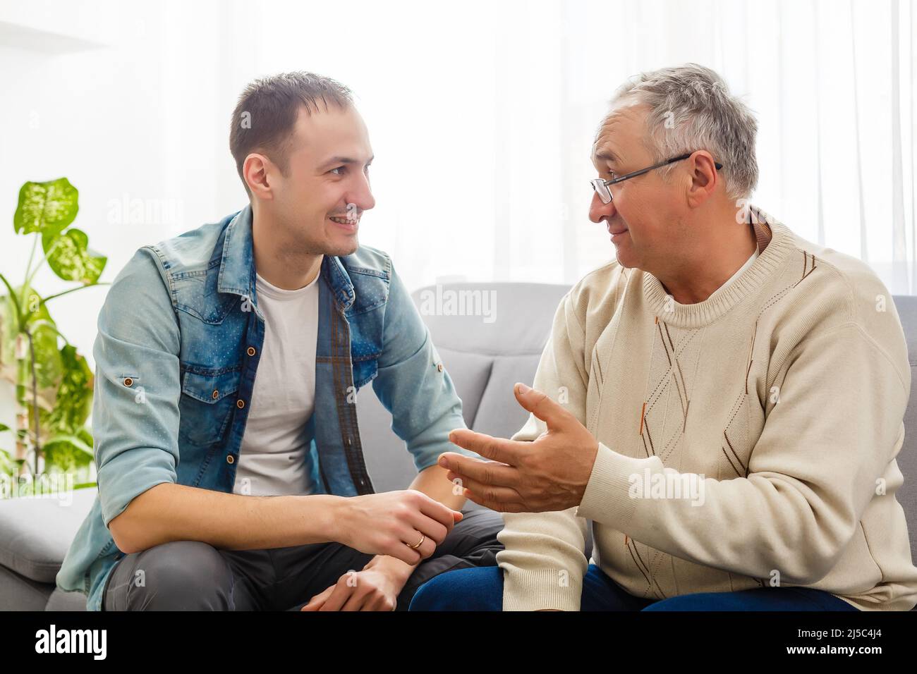 Son sitting father shoulder hi-res stock photography and images - Alamy