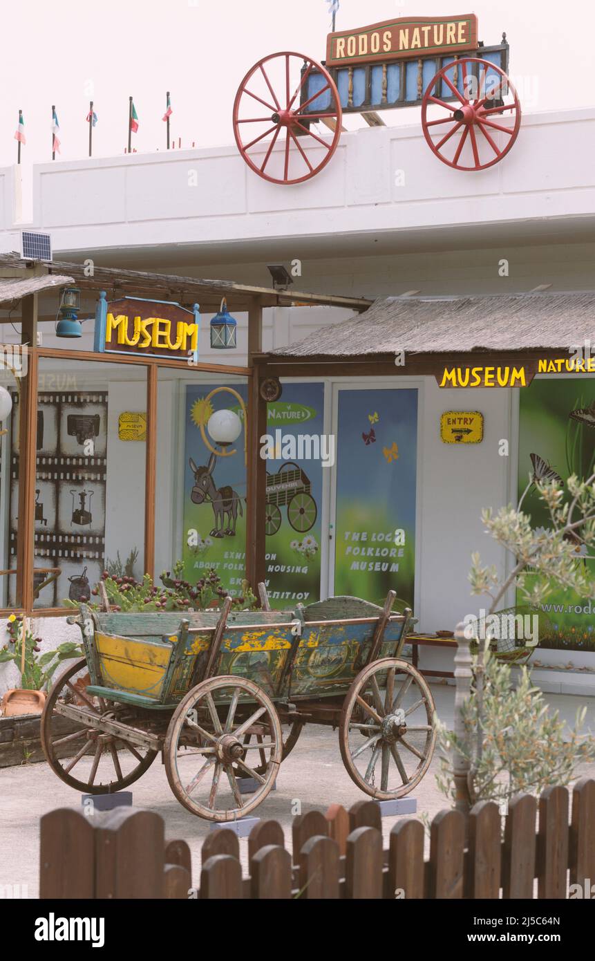 Kolymbia, Rhodes, Greece - May 23, 2019: Entrance to the folklore museum with signs in English and imitation of retro agricultural design Stock Photo