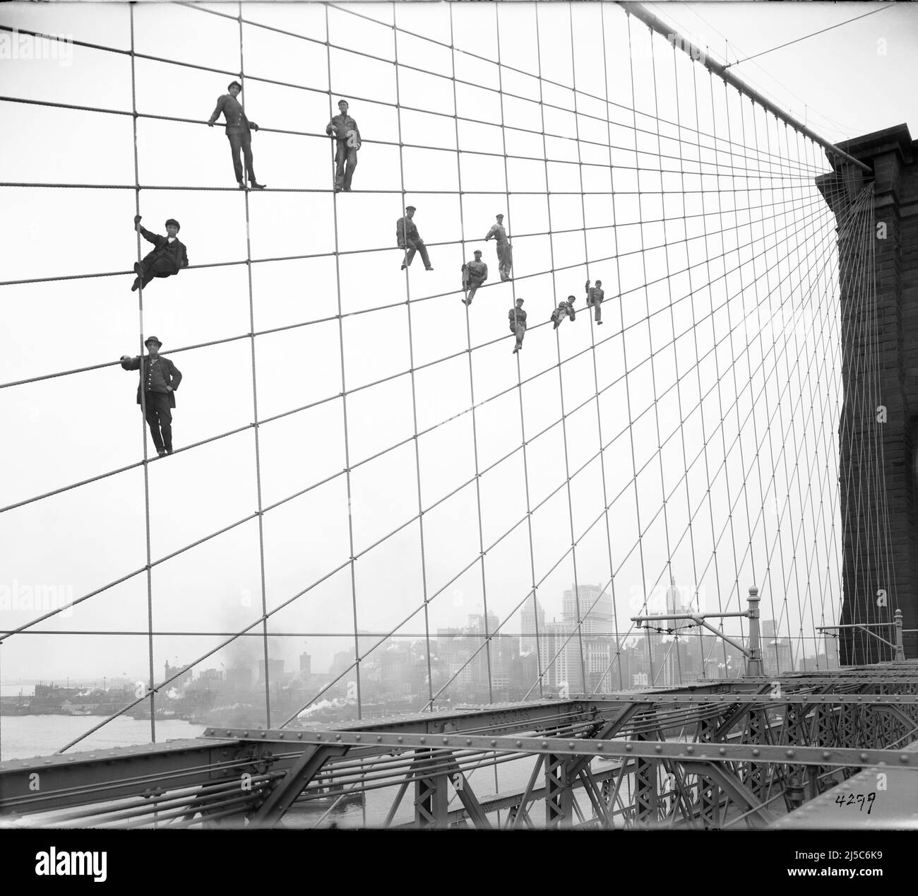Eugene de Salignac's Iconic Brooklyn Bridge photograph of painters posing at their place of work - 1914 Stock Photo