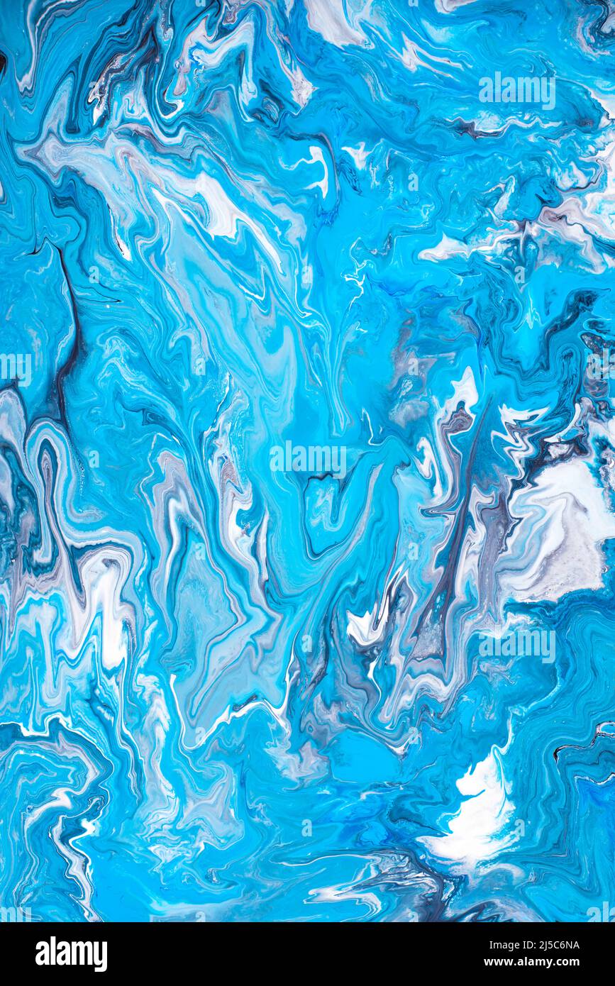 Free flowing blue and white acrylic paint. Random Waves and Curls. Abstract marble background/texture. Stock Photo