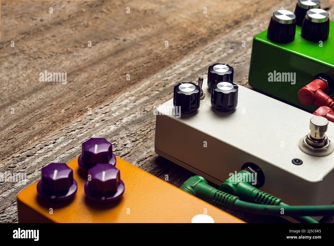 Three guitar pedals effects on wooden floor Stock Photo