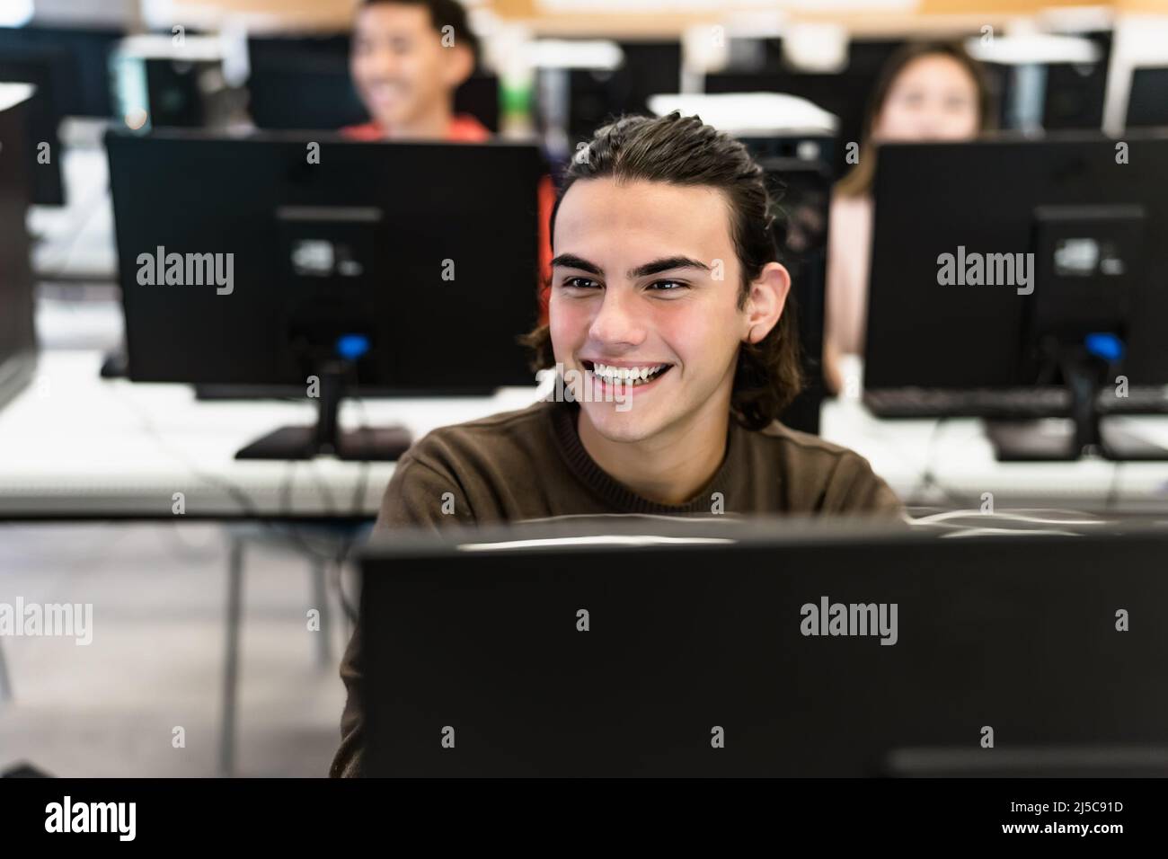Young students listening a lesson in high school - Education concept Stock Photo