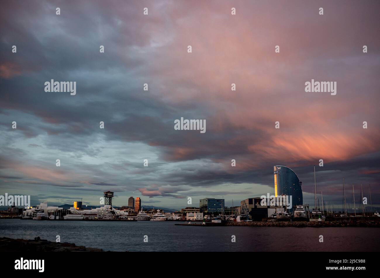 The sky clears over Barcelona's port following a day of storms and showers. Stock Photo