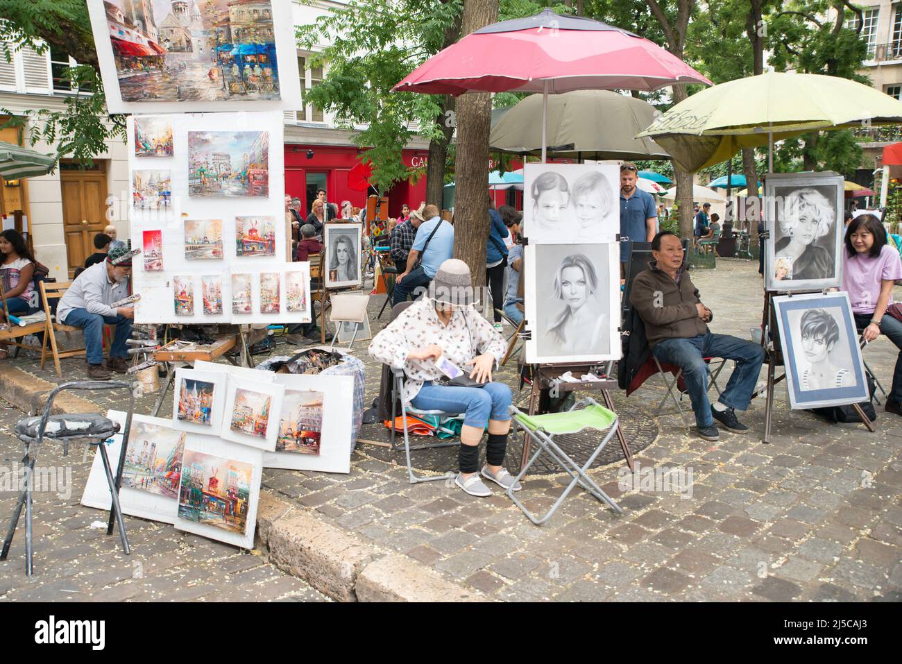 Montmartre Paris, painter at the place du tertre, tourism attraction in France, artists drawing portraits, Paris at the Montmartre on the 04.08.2017 Stock Photo