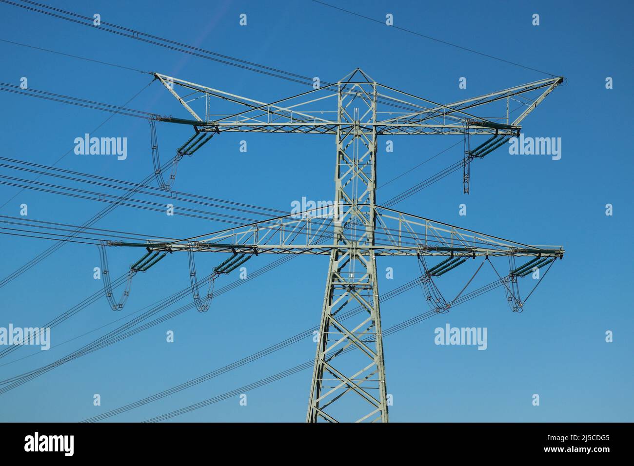 High steel pylons for high voltage power transmission Stock Photo - Alamy