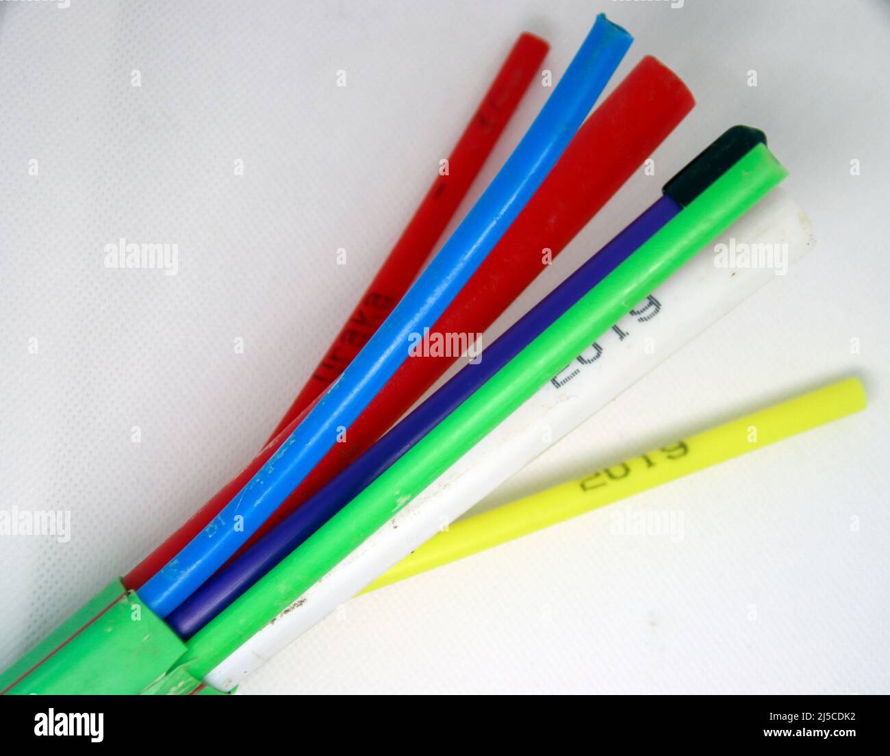 several small and medium hoses for glass fibers for internet connection at home Stock Photo