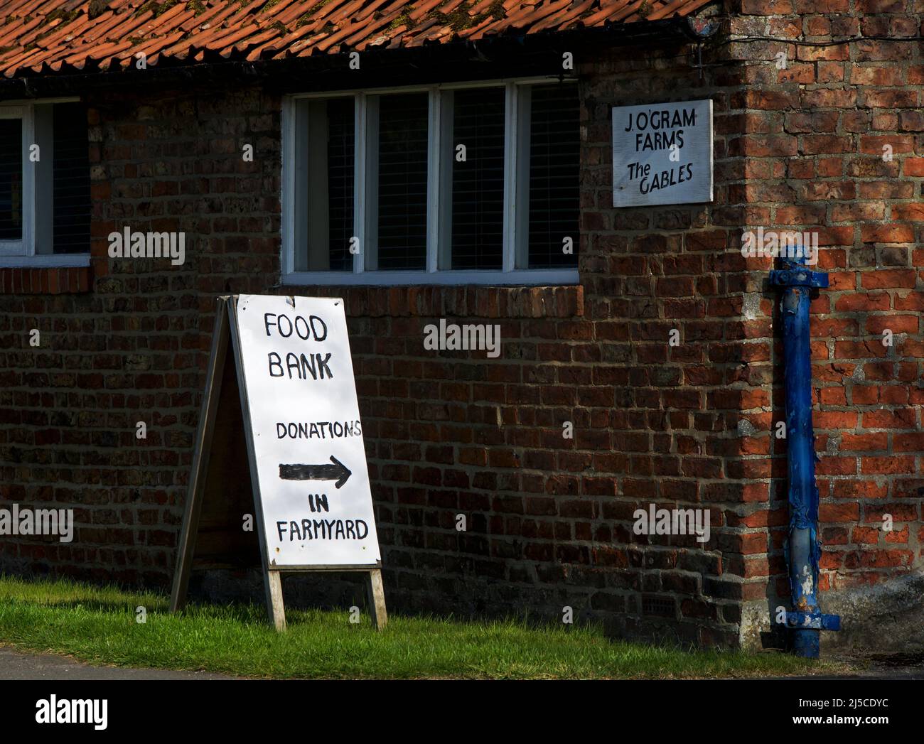 Sign for food bank at farm, in the village of Allerton, East Yorkshire, England UK Stock Photo