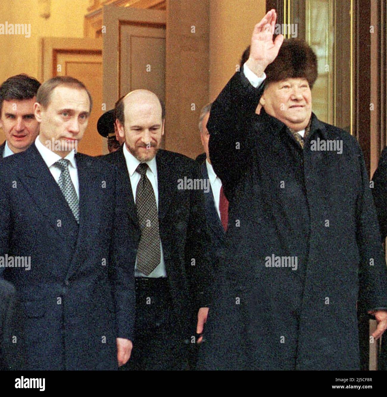 BORIS YELTSIN, Russian President, at right, announces his resignation on 3 December 1999