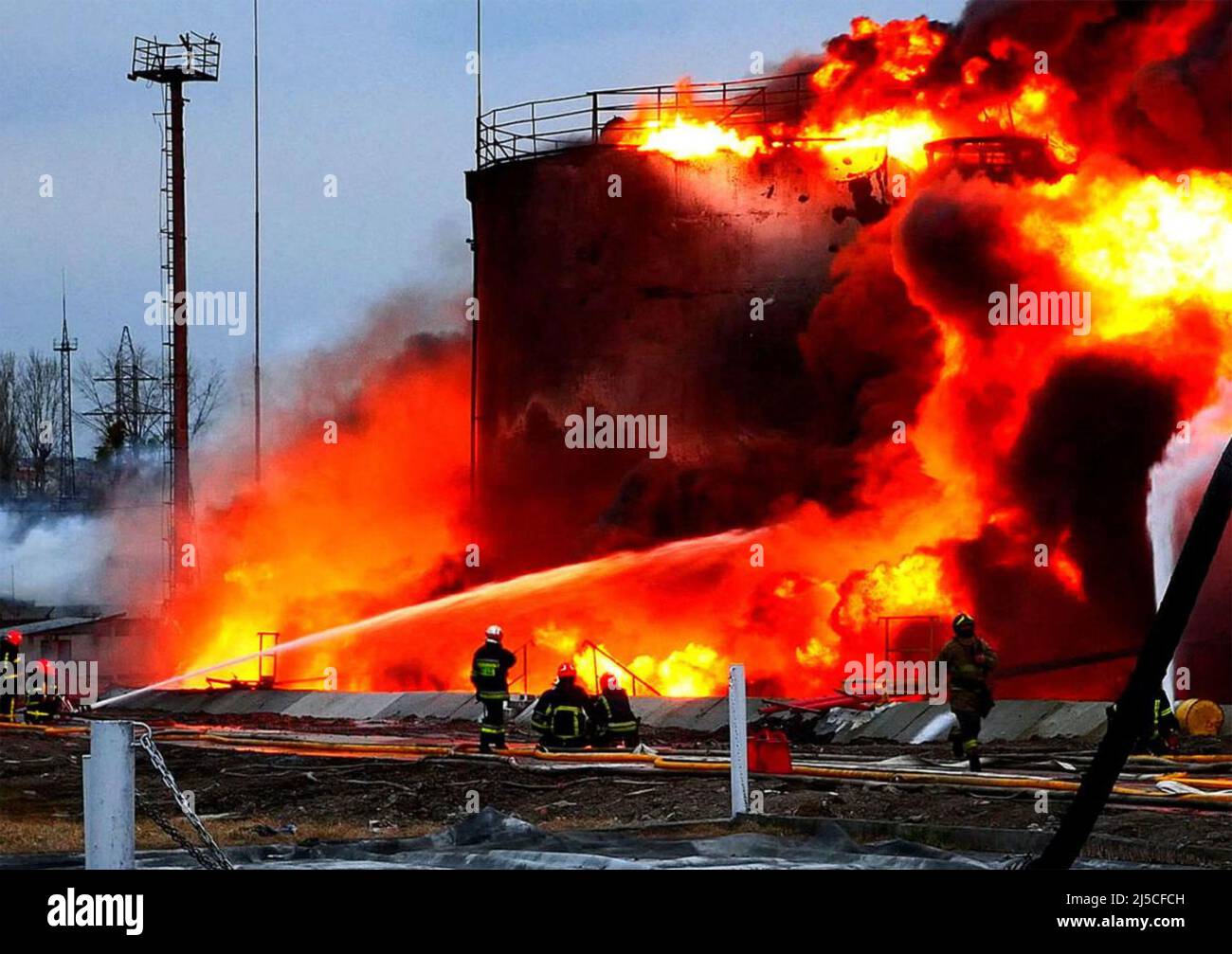 UKRANIAN FIREFIGHTERS at a Russian missle strike on an oil storage facility in March 2022.  Photo: Ukrainian State Emergency Service Stock Photo