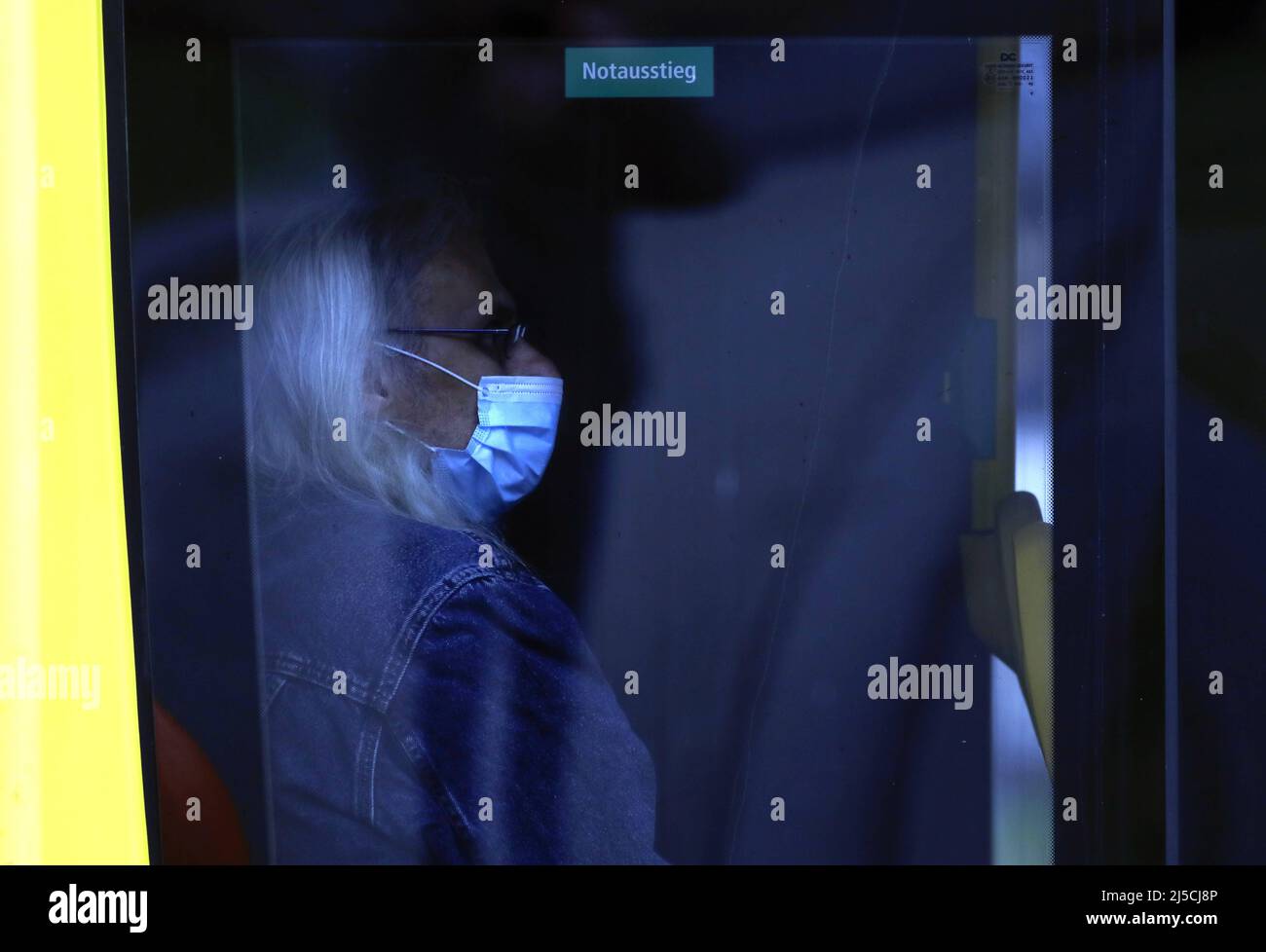 Passenger wearing a face mask on a bus. In Germany, it is now mandatory