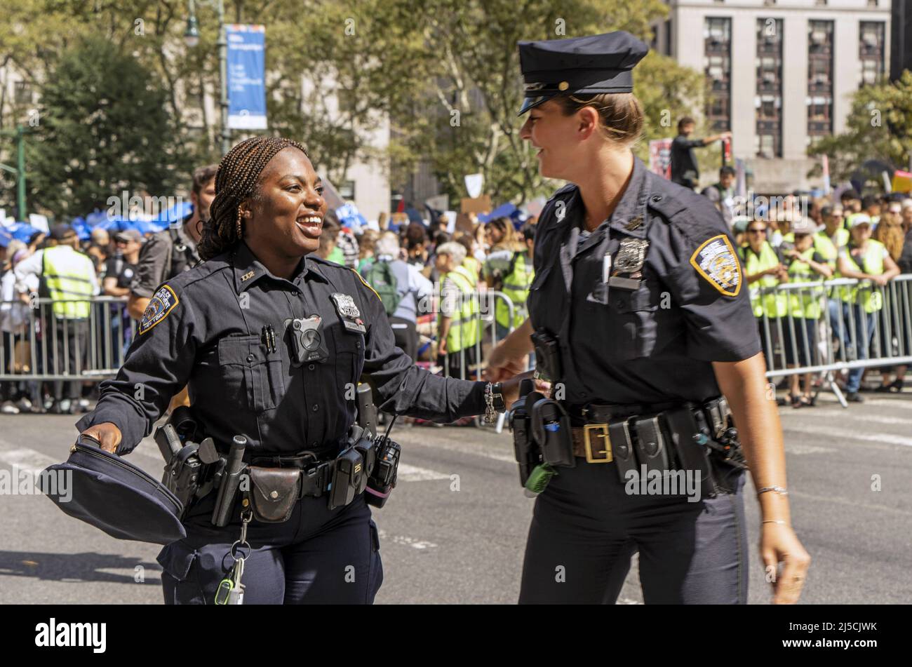USA, New York, Sept. 20, 2019 New York City Global Climate Strike in New York on Sept. 20, 2019. female police officers. Thousands of New York City students walk out of school to attend a rally on climate change. In what may be the largest climate protest in history, inspired by young Swedish activist Greta Thunberg. [automated translation] Stock Photo