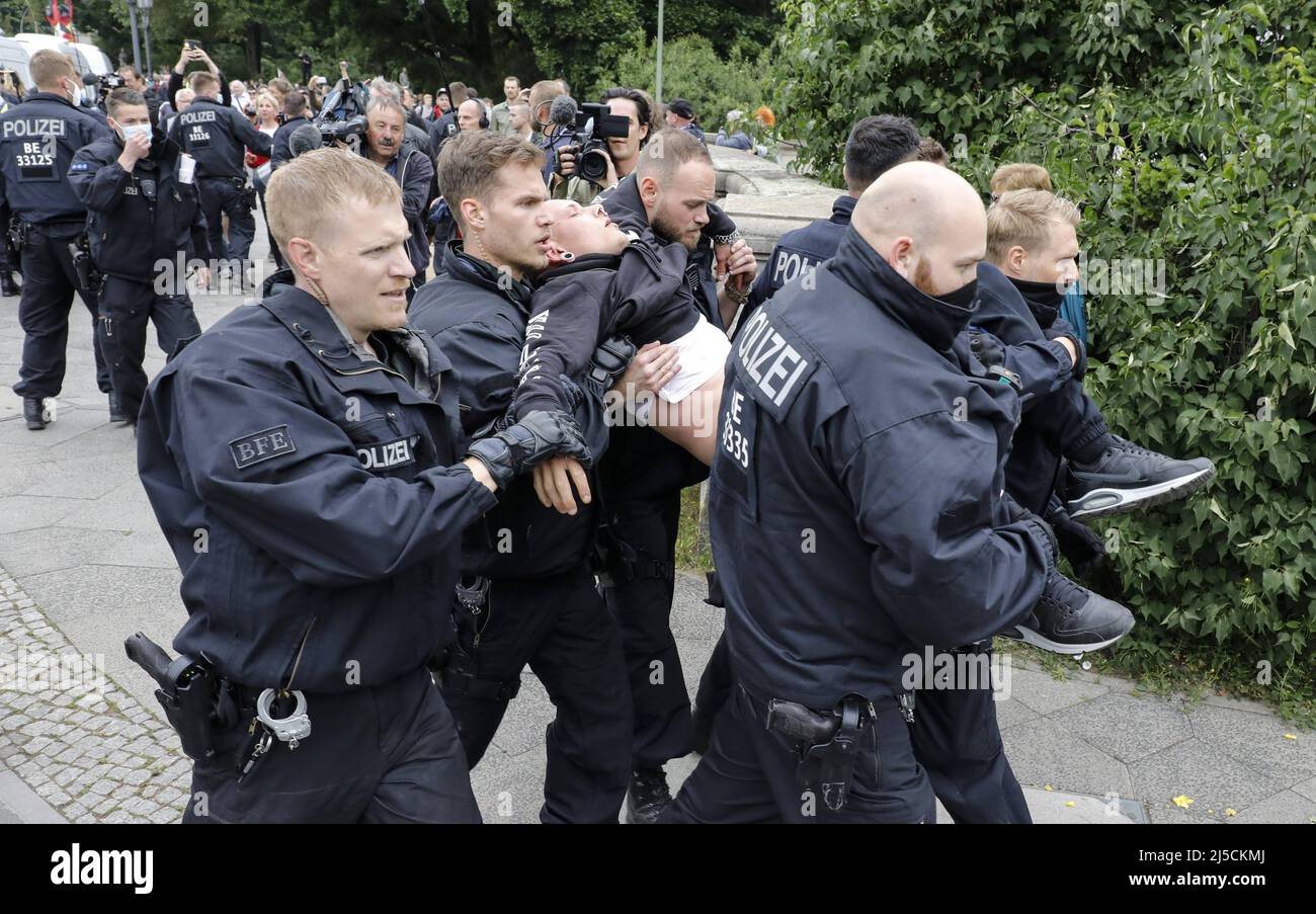 'A man is arrested by the police during an extreme right-wing Anti Corona Beschraenkungs Demo. The demonstration of the right-wing extremists was registered under the motto ''Homeland and World Peace''. [automated translation]' Stock Photo