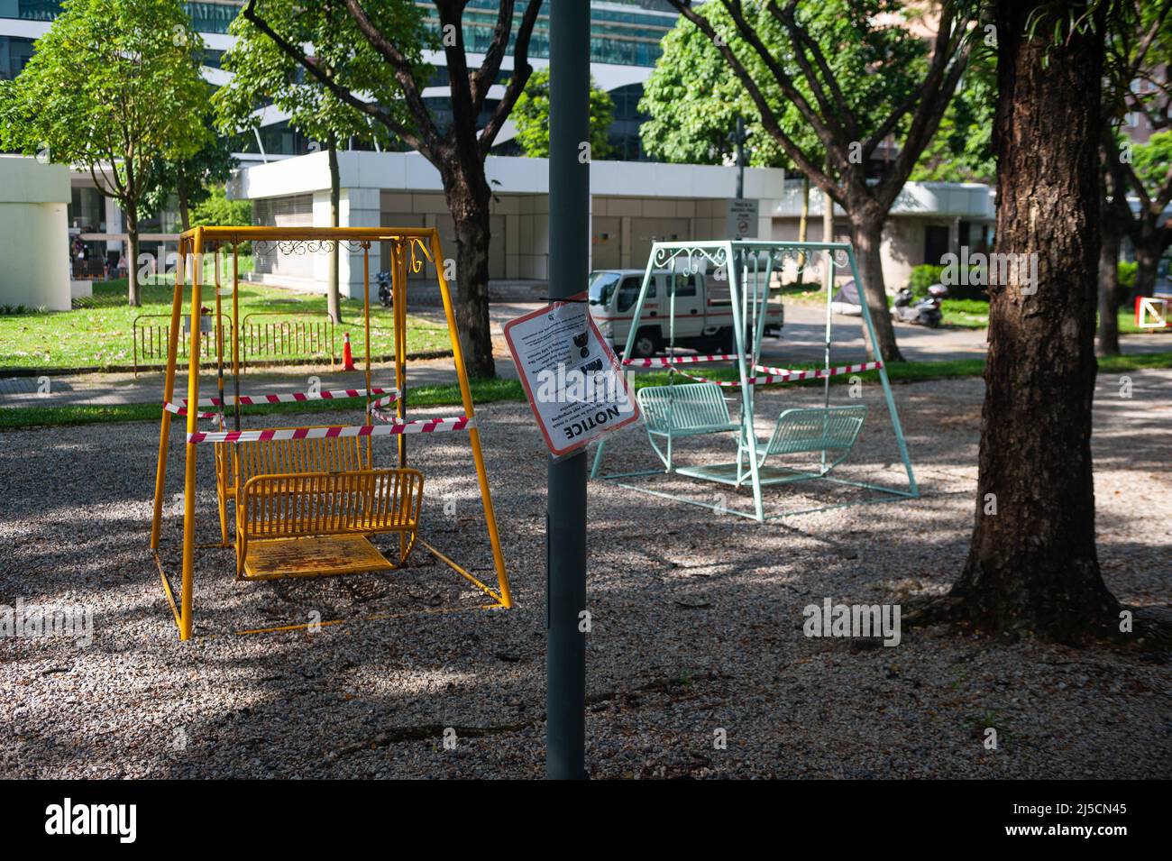 May 28, 2020, Singapore, Republic of Singapore, Asia - Swings in a small park in Dhoby Ghaut have been cordoned off with red and white barrier tape during curfews amid the Corona crisis to halt the spread of the pandemic coronavirus (Covid-19). Other precautionary measures were introduced in public life, such as the closure of all non-essential shops and retailers, as well as all schools until June 1. [automated translation] Stock Photo