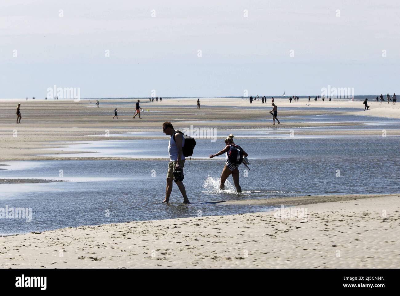 Holidaymakers on the beach on the island of Amrum. In Schleswig-Holstein, numerous relaxations in the Corona crisis have come into force. After the end of the lockdown, vacationers are allowed to travel to the North Frisian islands again. [automated translation] Stock Photo