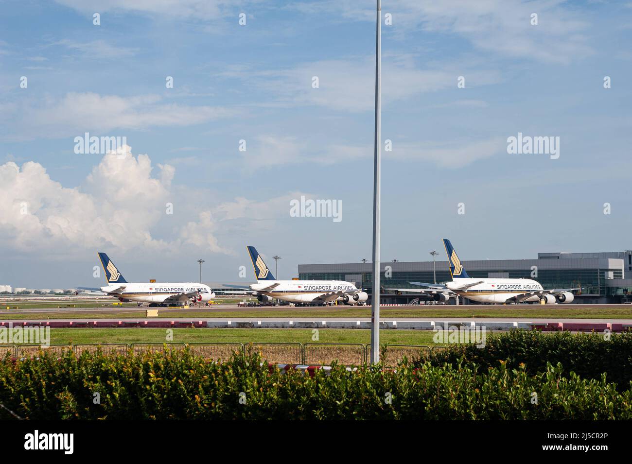 Aug. 28, 2020, Singapore, Republic of Singapore, Asia - Temporarily grounded Airbus A380 passenger aircraft operated by state-owned Singapore Airlines (SIA) park at Terminal 4 at Changi Airport. Due to the global spread of the coronavirus (Covid-19), worldwide air traffic has been drastically reduced and significant flight cancellations continue to occur. SIA currently operates only a fraction of its route network, while most aircraft remain grounded. [automated translation] Stock Photo