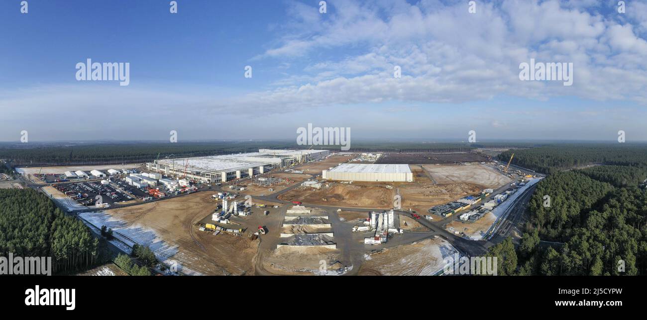 Gruenheide, DEU, 26.01.2021 - Panorama aerial view of Tesla Gigafactory 4 construction site in the Freienbrink district of Gruenheide. In the background, further forest clearings can be seen. The Gigafactory is scheduled to start producing Tesla vehicles in July 2021. [automated translation] Stock Photo