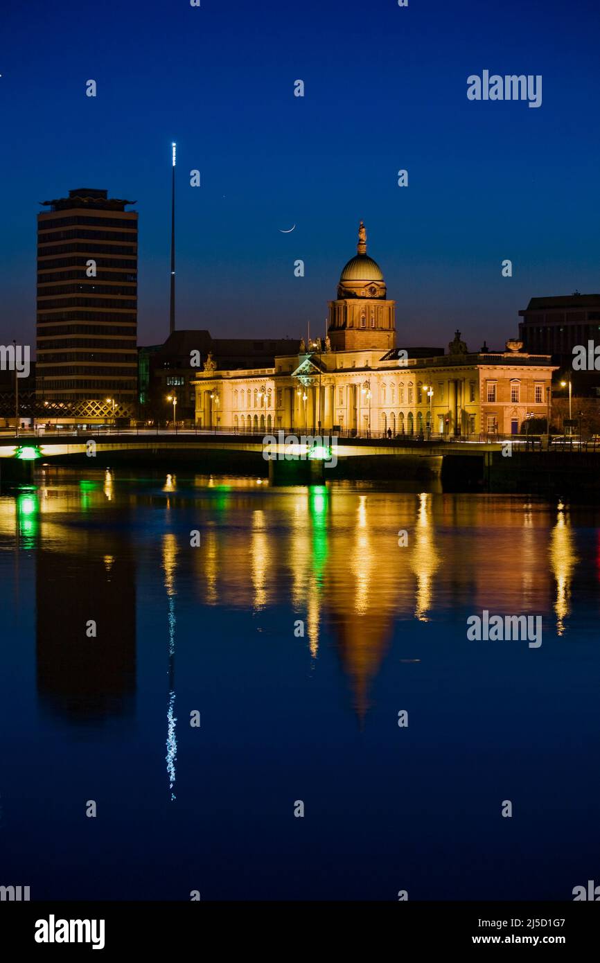 A floodlitCustom House at dusk on the River Liffy, Dublin, Ireland Stock Photo