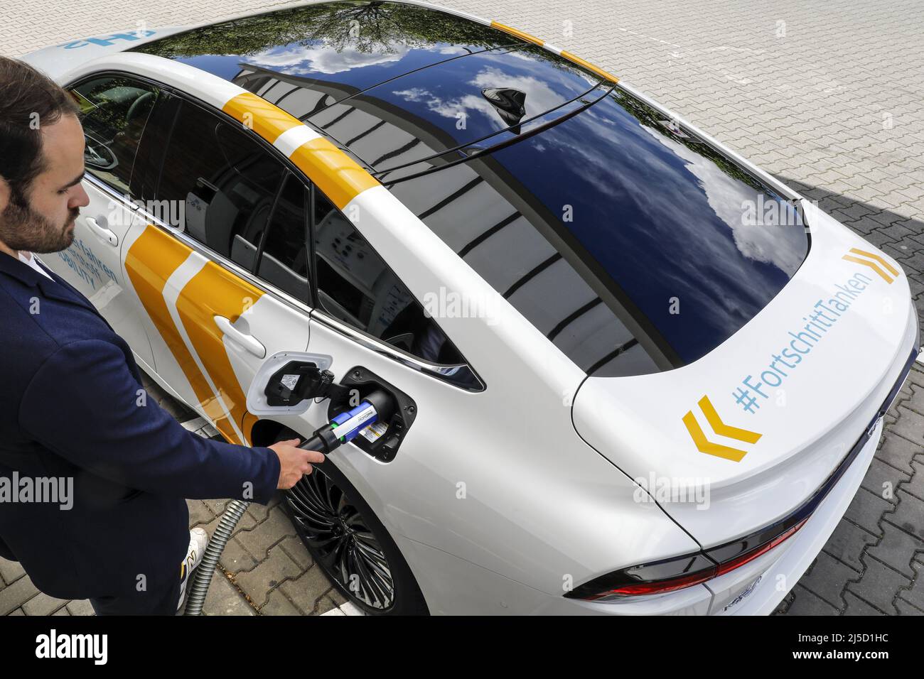 Berlin, May 17, 2021 - Refueling of a fuel cell vehicle, a Toyota Mirai ...