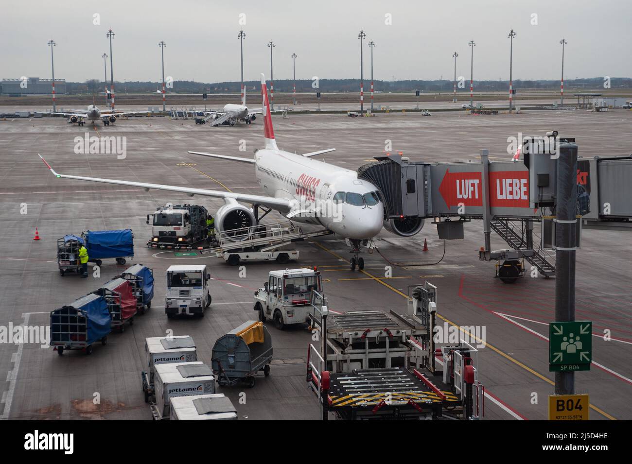 'Dec. 14, 2021, Berlin, Germany, Europe - An Airbus A220-300 passenger aircraft of Swiss Airlines parks at a gate at Berlin Brandenburg ''Willy Brandt'' Airport. Swiss is a member of the Star Alliance aviation alliance, an international network of airlines. [automated translation]' Stock Photo