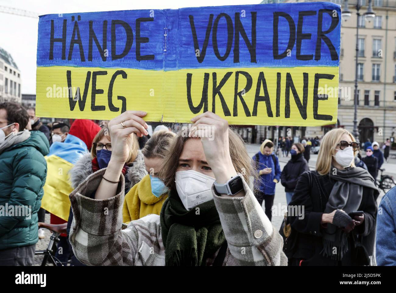 'Berlin, Feb. 24, 2022 - Following Russia's attack on Ukraine, Ukrainians demonstrate at Berlin's Brandenburg Gate under the slogan ''Stop Putin, stop the war.'' [automated translation]' Stock Photo
