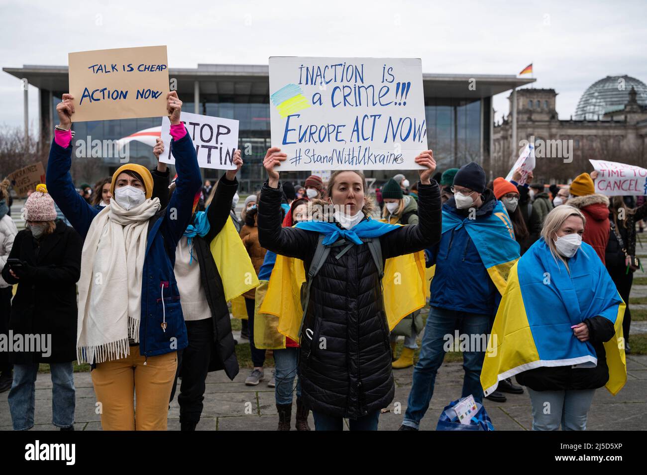 '24.02.2022, Berlin, Germany, Europe - Demonstration in front of the Federal Chancellery in the district Tiergarten in Mitte of Ukrainians and supporters living in Berlin and Germany under the slogan ''Solidarity with Ukraine - Hands off Ukraine - Stop Putin Now'' against the policy of Russian President Putin and the war in Ukraine after the invasion of Russian soldiers and the shelling of Ukrainian cities by Russian forces. The demonstrators are demanding the immediate withdrawal of Russian troops, a political solution to the conflict, the support of the German government and immediate Stock Photo