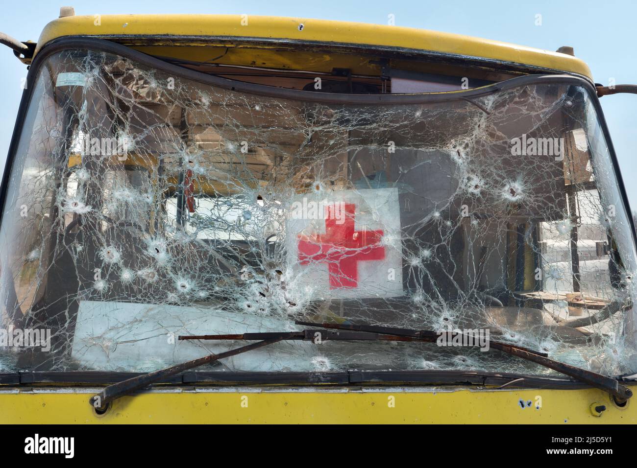 2022 War Russia invasion Ukraine war crimes. Mark bullet car destroyed bus crash. Bus evacuating civilian shooting bullet glass hole shot bullet Stock Photo